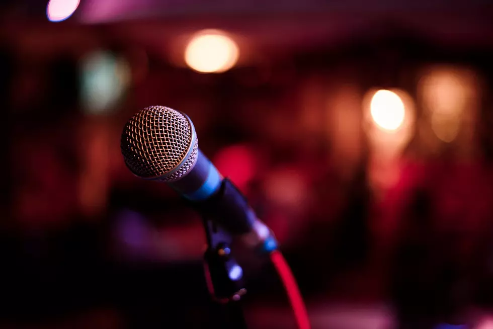 microphone against and music notes blur colorful light background